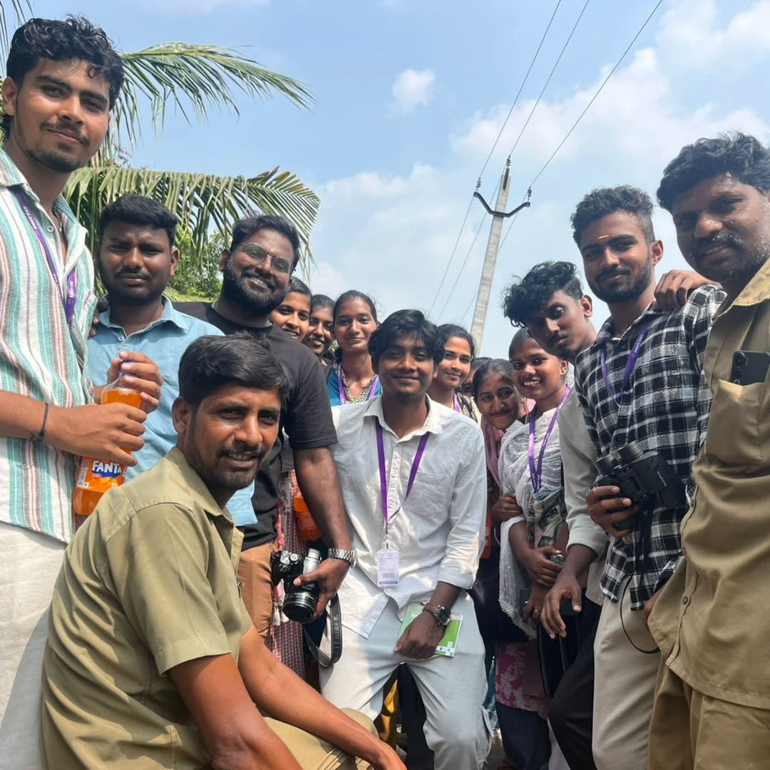 Students planting saplings near river